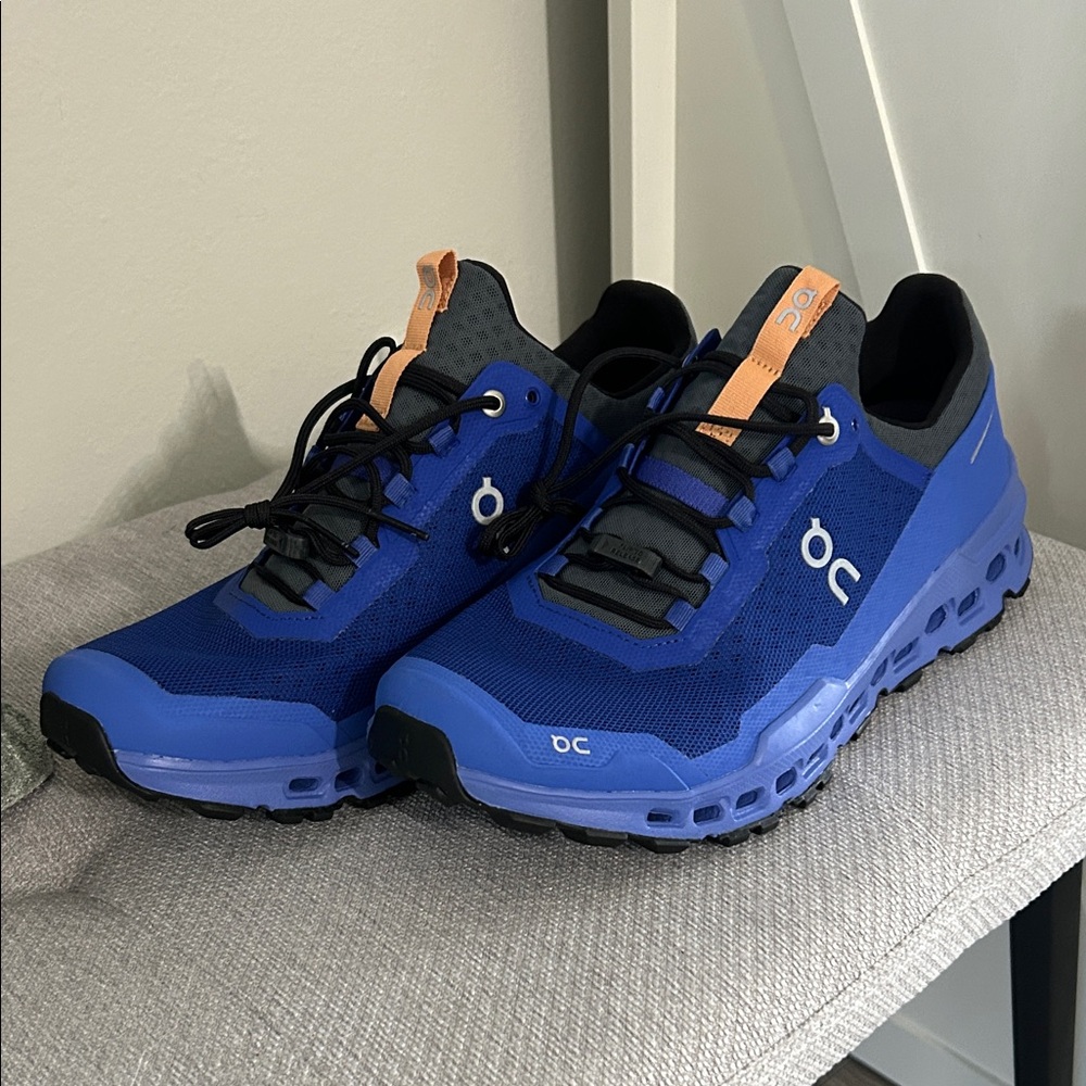 On Running Men's Athletic Shoes in Blue with Orange Accents